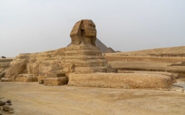 The Great Sphinx of Giza, a monumental statue, stands in Egypt, a highlight of group tours and vacation packages.