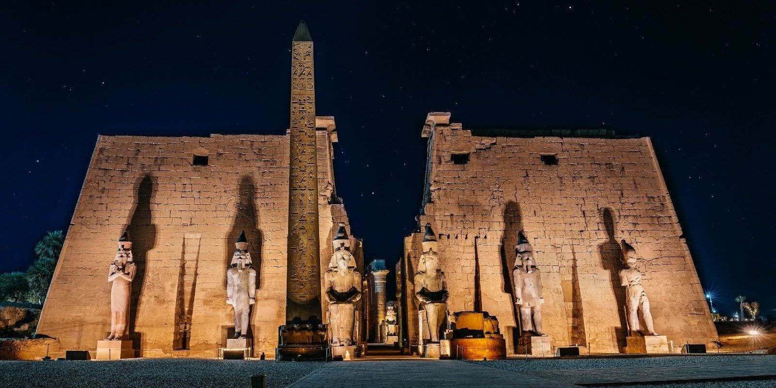 Luxor temple1 The Temple of Karnak and its obelisk illuminated at night, showcasing Egypt's rich history and beauty.