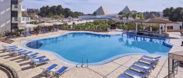 Great Pyramids of Giza visible in the background.